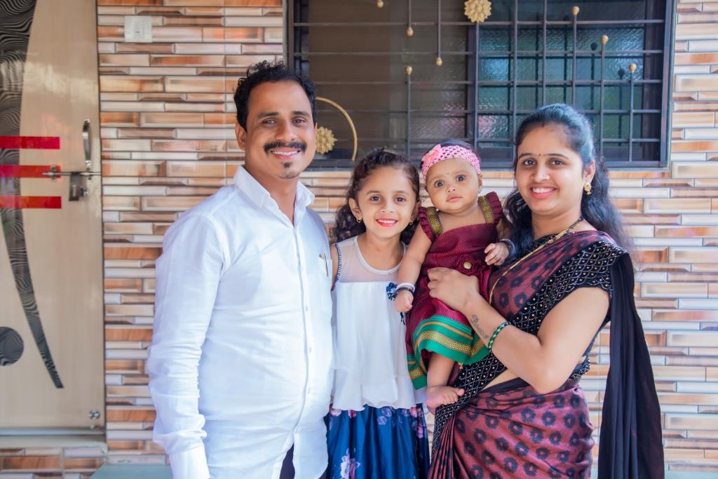Mokshada at 7 months with family