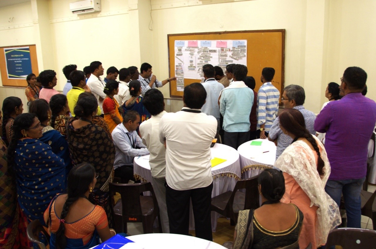 Participants discussing newspaper articles to understand the dimensions of the present scenarios at the Transformative Scenario Planning (TSP) Workshop for Farmer Producer Organisations